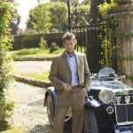 Bladen jacket man posing with car